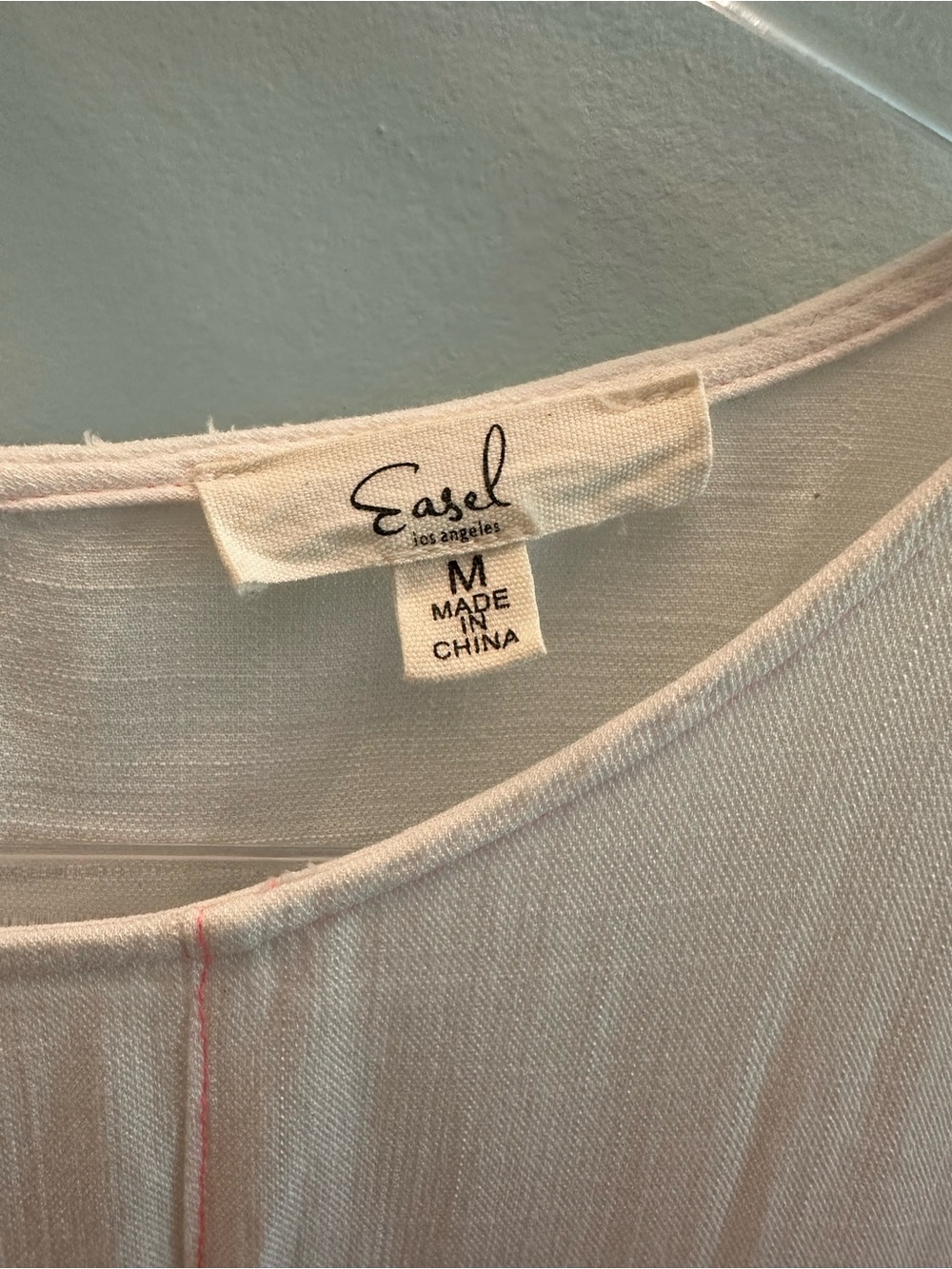 Easel Los Angeles Women’s White Scoop Neck Blouse with pink stitching